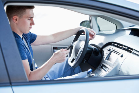 Young man looking at his phone